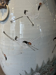 A pair of Chinese famille rose vases with cranes, 19th C.
