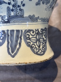 A blue and white Dutch Delft bottle-shaped chinoiserie vase with a lion, 17th C.