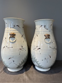 A pair of Chinese famille rose vases with cranes, 19th C.