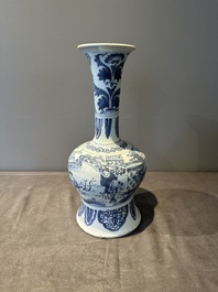A blue and white Dutch Delft bottle-shaped chinoiserie vase with a lion, 17th C.