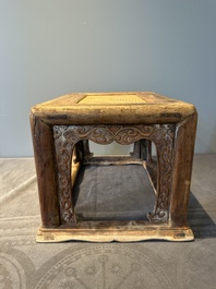 A Chinese rectangular huanghuali wooden stool with 'chilong' design, 17/18th C.