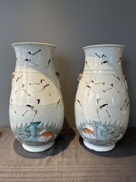 A pair of Chinese famille rose vases with cranes, 19th C.
