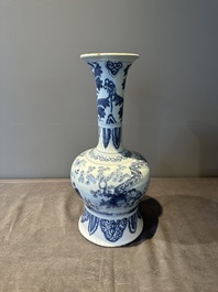 A blue and white Dutch Delft bottle-shaped chinoiserie vase with a lion, 17th C.