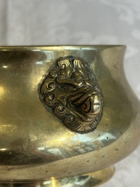 A Chinese bronze elephant-head-handled censer, Xuande mark, Kangxi/Qianlong