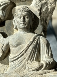A Gandhara grey schist fragment of a seated Buddha with his disciple and a fragment with five figures, 1st/3rd C.