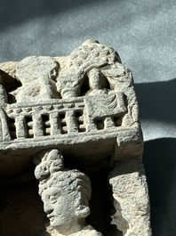 A Gandhara grey schist fragment of a seated Buddha with his disciple and a fragment with five figures, 1st/3rd C.