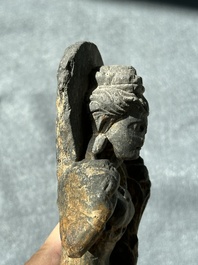 A Gandhara grey schist sculpture of the Bodhisattva Maitreya, a sculpture of a master with a child and a fragment of a divinity, 1/5th C.