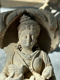 A Gandhara grey schist sculpture of the Bodhisattva Maitreya, a sculpture of a master with a child and a fragment of a divinity, 1/5th C.