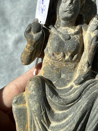 A Gandhara grey schist sculpture of the Bodhisattva Maitreya, a sculpture of a master with a child and a fragment of a divinity, 1/5th C.