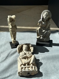 A Gandhara grey schist sculpture of the Bodhisattva Maitreya, a sculpture of a master with a child and a fragment of a divinity, 1/5th C.