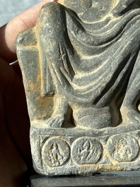 A Gandhara grey schist sculpture of the Bodhisattva Maitreya, a sculpture of a master with a child and a fragment of a divinity, 1/5th C.