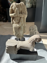 Two Gandhara grey schist torsos of Buddha and a tiger sculpture, 1st/3rd C.