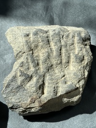 A Gandhara grey schist fragment of a seated Buddha with his disciple and a fragment with five figures, 1st/3rd C.