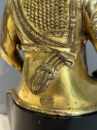An extremely rare Chinese gilt bronze figure of Guandi, Ming