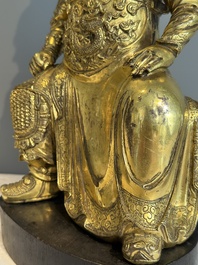 An extremely rare Chinese gilt bronze figure of Guandi, Ming