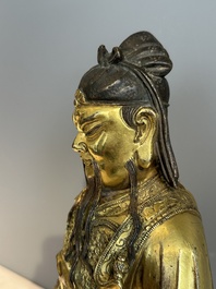 An extremely rare Chinese gilt bronze figure of Guandi, Ming