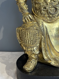 An extremely rare Chinese gilt bronze figure of Guandi, Ming