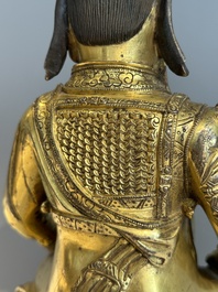 An extremely rare Chinese gilt bronze figure of Guandi, Ming