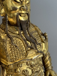 An extremely rare Chinese gilt bronze figure of Guandi, Ming