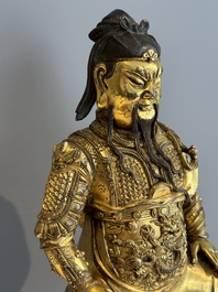 An extremely rare Chinese gilt bronze figure of Guandi, Ming