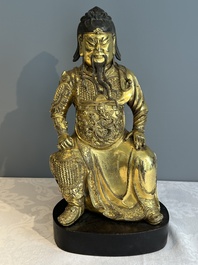 An extremely rare Chinese gilt bronze figure of Guandi, Ming