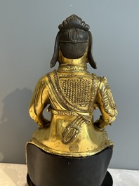An extremely rare Chinese gilt bronze figure of Guandi, Ming