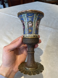 A gilt copper and enamelled water pipe base on wooden stand, Qajar, Iran, 19th C.