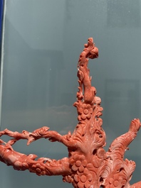 A Chinese red coral group of birds among flowering branches, 19/20th C.
