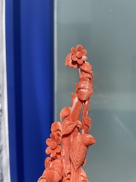 A Chinese red coral group of birds among flowering branches, 19/20th C.