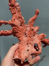 A Chinese red coral group of birds among flowering branches, 19/20th C.