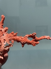A Chinese red coral group of birds among flowering branches, 19/20th C.