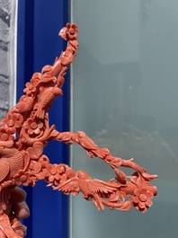 A Chinese red coral group of birds among flowering branches, 19/20th C.