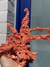 A Chinese red coral group of birds among flowering branches, 19/20th C.