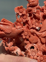 A Chinese red coral group of birds among flowering branches, 19/20th C.