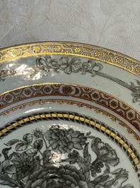 Two Chinese export grisaille cups and saucers and a plate, Qianlong