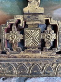 A rare Chinese gilt wood and reverse glass painted mirror, 2nd half 18th C.