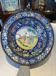 A large Chinese Canton enamel basin with figures in a landscape, Jiaqing