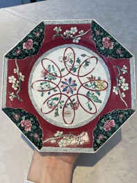 Four octagonal Chinese famille rose ruby-ground plates with floral design, Yongzheng