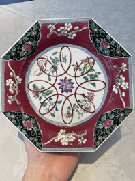 Four octagonal Chinese famille rose ruby-ground plates with floral design, Yongzheng