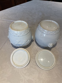 A pair of Chinese Canton famille rose vases and a pair of Dehua blanc de Chine drum-shaped covered jars, 19th C.