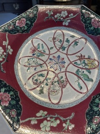 Four octagonal Chinese famille rose ruby-ground plates with floral design, Yongzheng