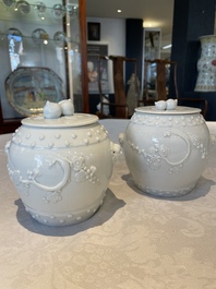 A pair of Chinese Canton famille rose vases and a pair of Dehua blanc de Chine drum-shaped covered jars, 19th C.