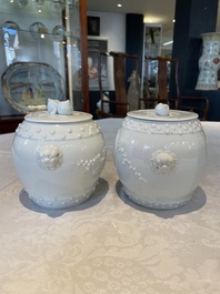 A pair of Chinese Canton famille rose vases and a pair of Dehua blanc de Chine drum-shaped covered jars, 19th C.