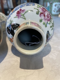 A pair of Chinese Canton famille rose vases and a pair of Dehua blanc de Chine drum-shaped covered jars, 19th C.