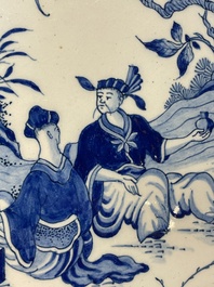 A blue and white Dutch Delft chinoiserie plaque with a tea drinking scene, 18th C.