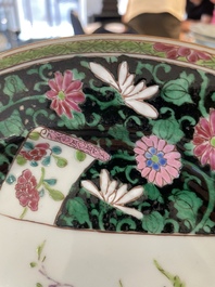 A pair of Chinese famille rose black-ground 'flowers and scrolls' plates, Yongzheng/Qianlong
