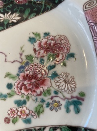 A pair of Chinese famille rose black-ground 'flowers and scrolls' plates, Yongzheng/Qianlong