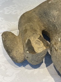 A sandstone torso and a Buddha head, Cambodia, late Khmer period, 13/14th C.