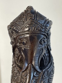 A collection of six krises with carved handles, four with scabbard, Indonesia, 19th C.
