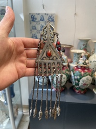 Two silver bracelets, two pendants with carnelian stones, a silver back ornament and a silver capstone, Turkmenistan, 19/20th C.